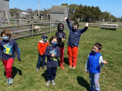 a group of kids in a field