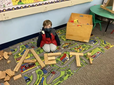 a child sitting on a toy train