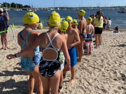 a group of people on a beach