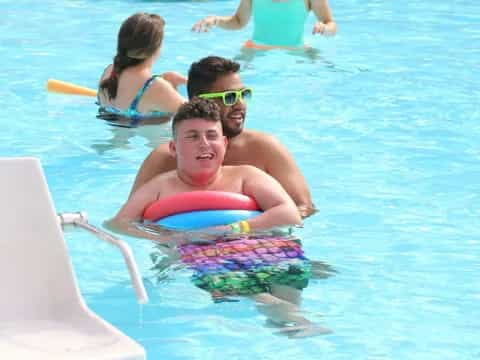 a group of people in a pool