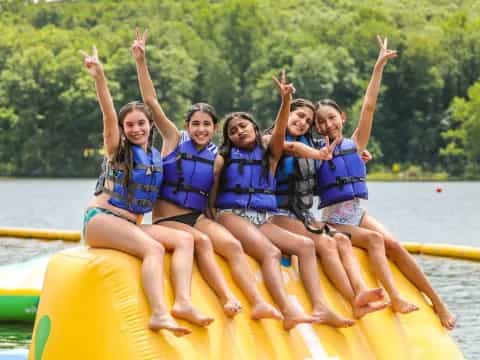 a group of girls in a raft