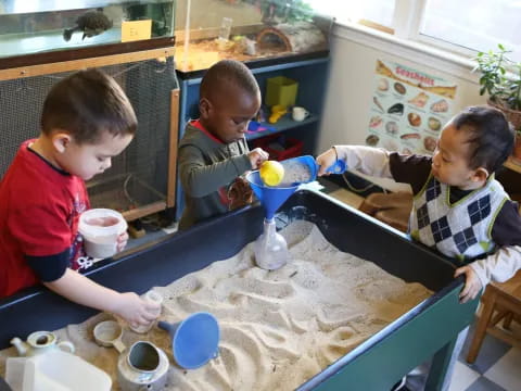 a group of children painting