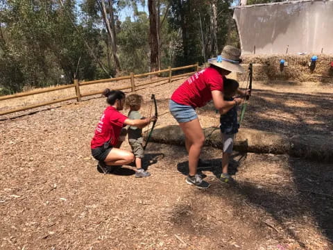 a group of people digging in the dirt