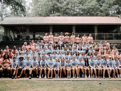 a large group of people posing for a photo