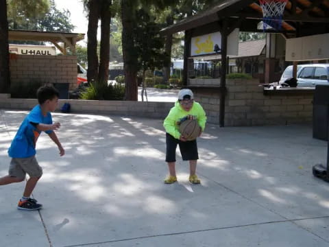 a person and a boy playing with a frisbee