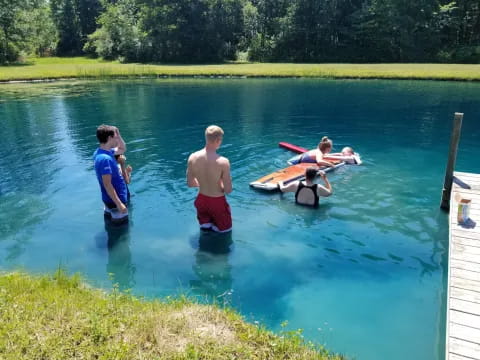a group of people in a lake