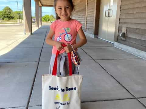 a girl holding a bag