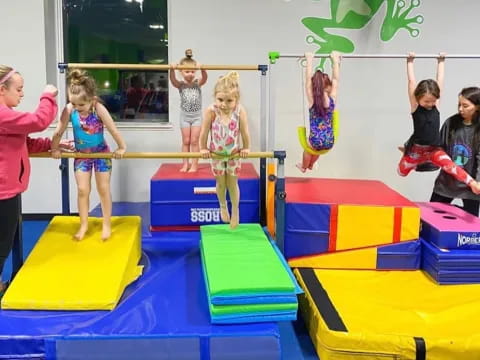 a group of children playing on mats