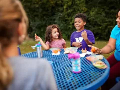 a group of people eating at a table