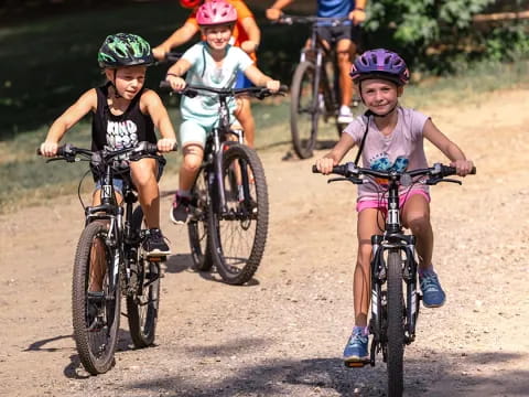 a group of kids riding bikes