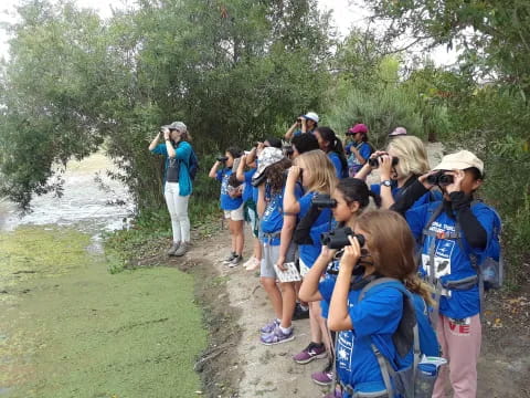 a group of people taking pictures