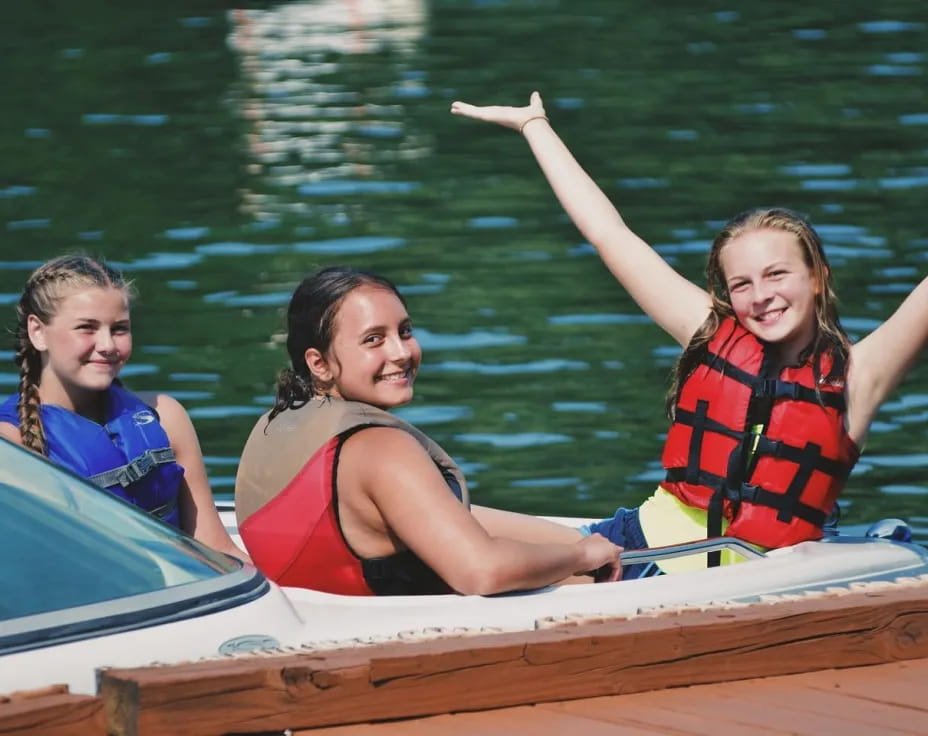 a group of girls in a boat