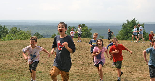 a group of people running on a field