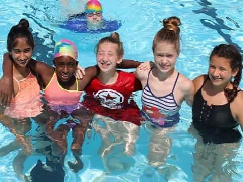 a group of people in a pool