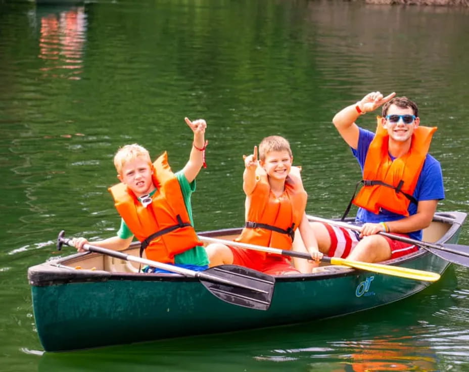 a group of people in a canoe