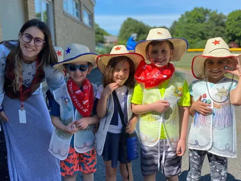 a group of children wearing hats