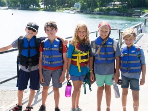a group of people wearing life vests