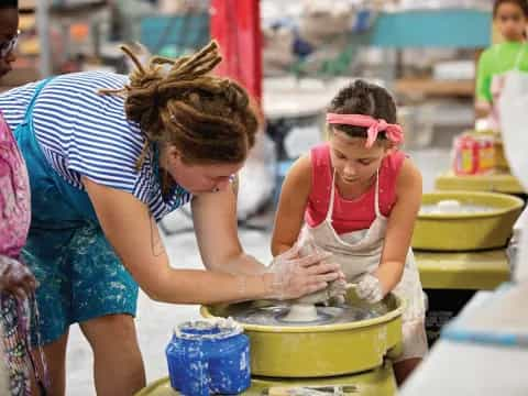 a person washing a child in a bucket