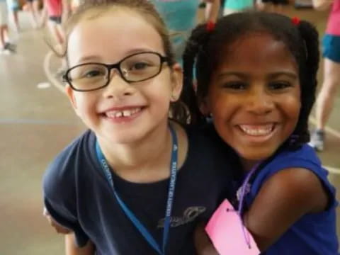 a couple of girls smiling