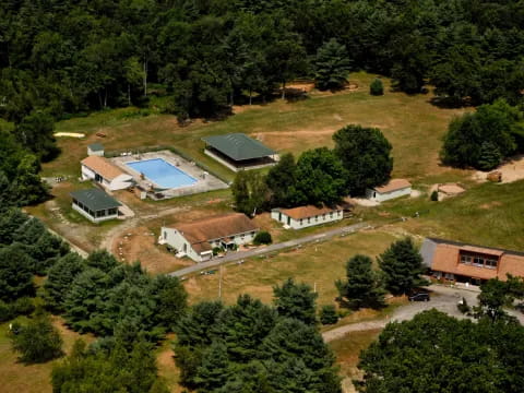 a group of houses surrounded by trees