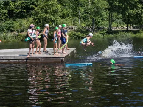 a group of people on a dock