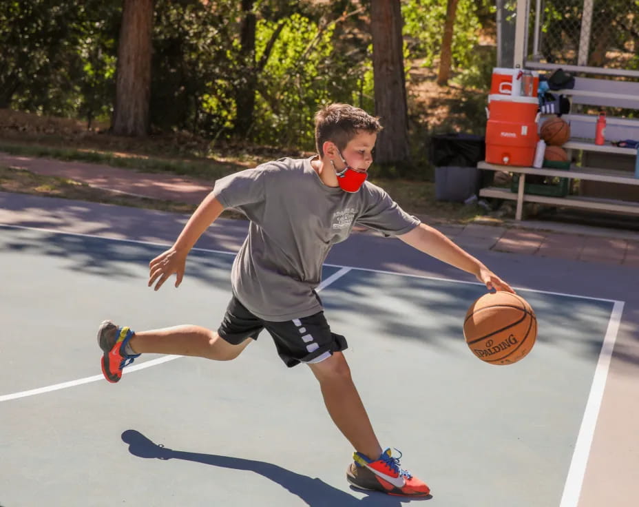 a boy playing basketball