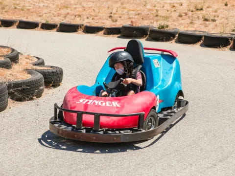 a person driving a go kart