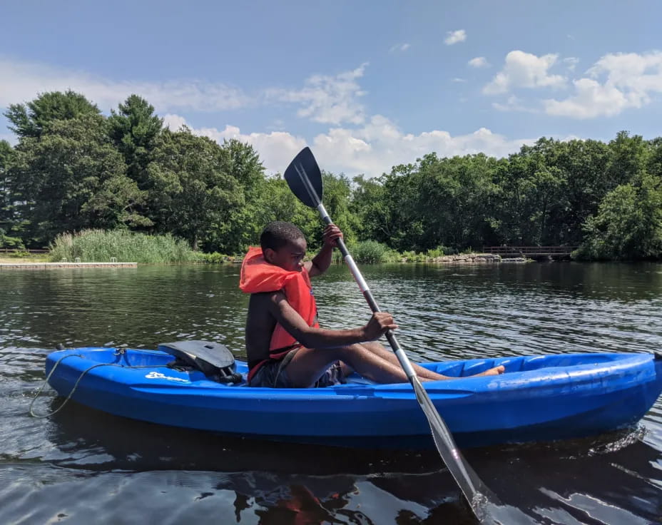 a boy in a kayak