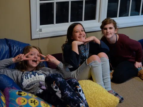 a group of women sitting on a couch