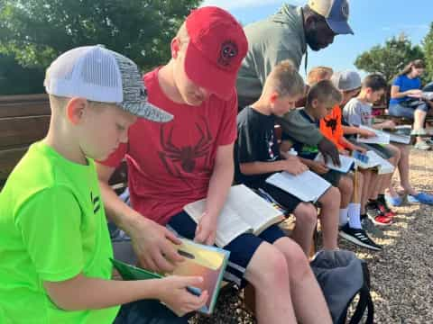 a group of children reading books