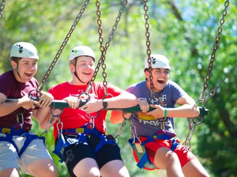 a group of people on a zip line