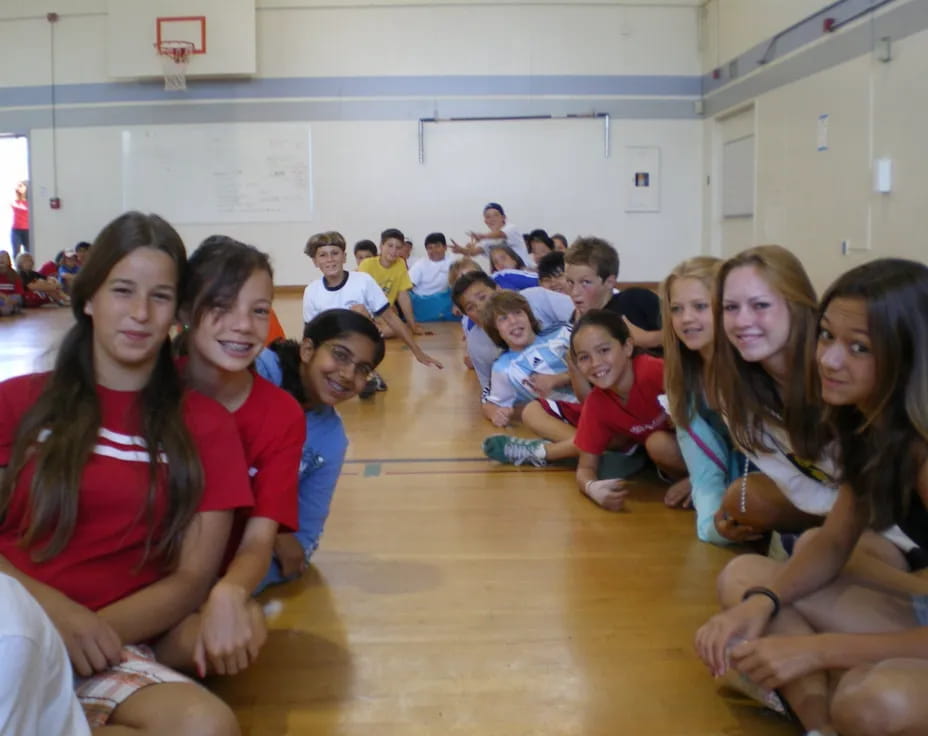 a group of people sitting on the floor