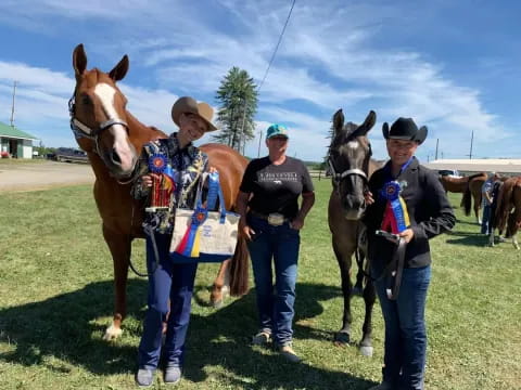 a group of people with horses