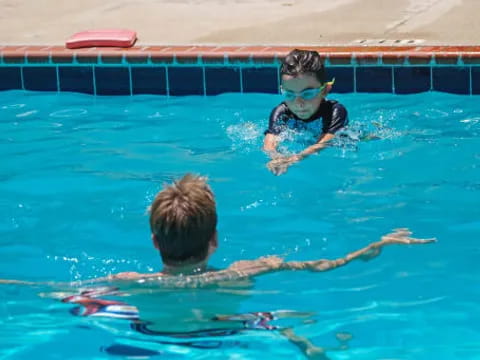 a couple of people in a pool