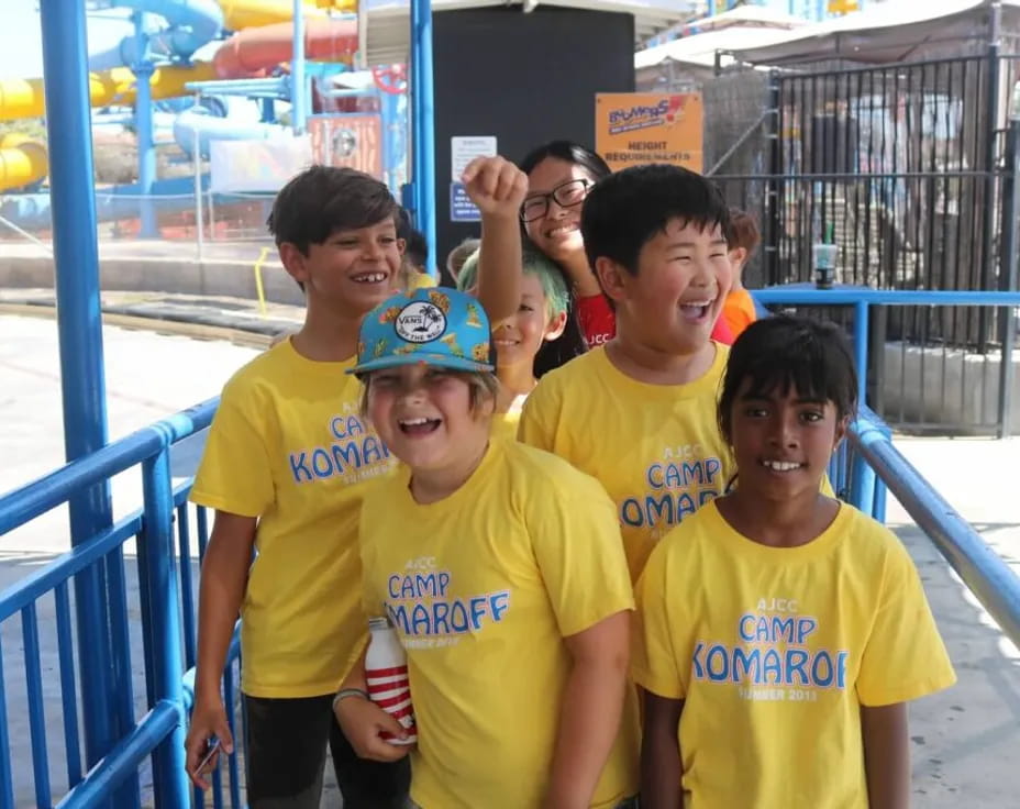 a group of boys in yellow shirts