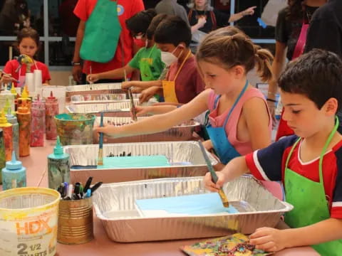 children painting on a table