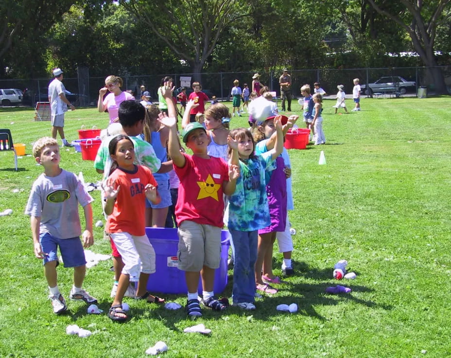 a group of children playing with balls