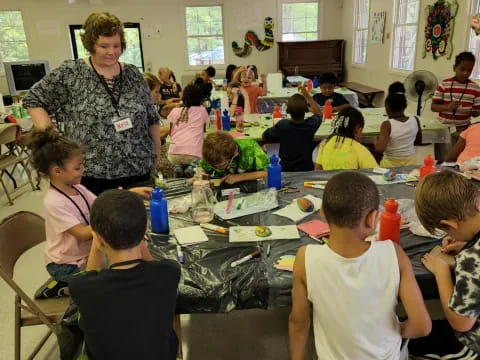 a person teaching children in a classroom