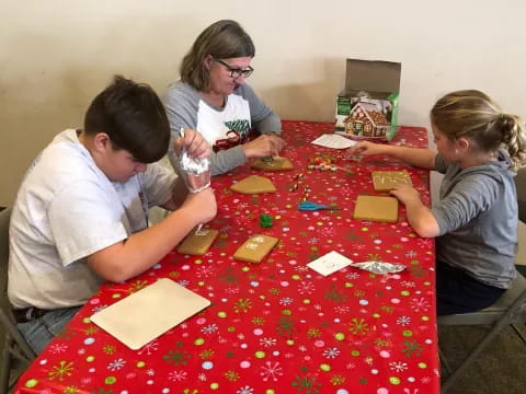 a group of people sitting around a table with cards on it