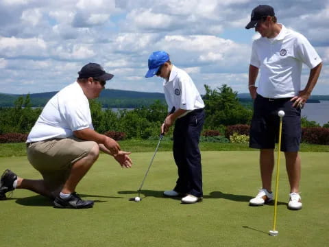 a group of men playing golf