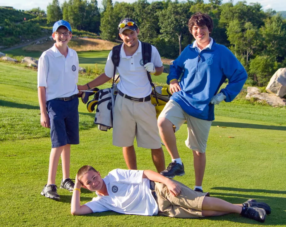 a group of people standing around a person lying on the ground