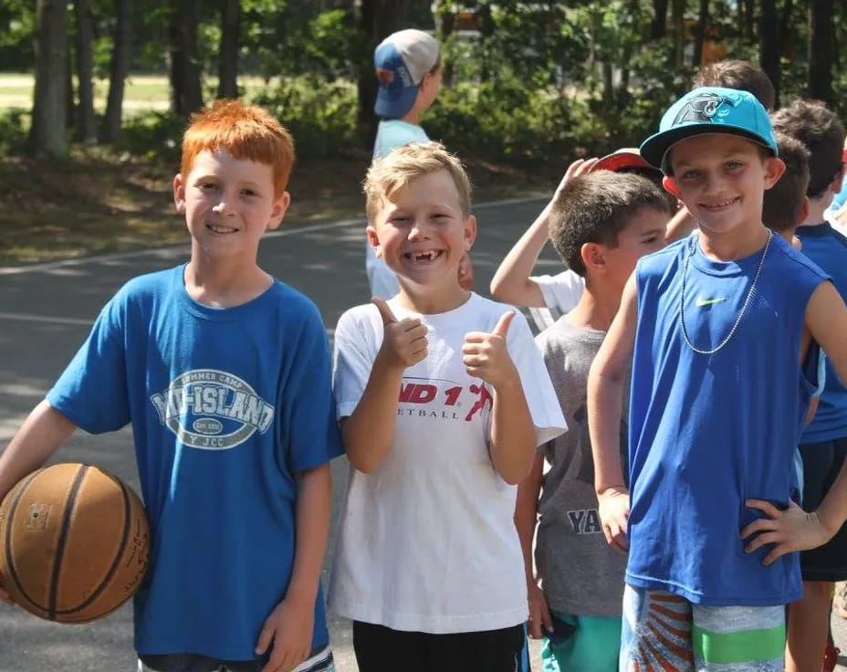 a group of boys holding a basketball