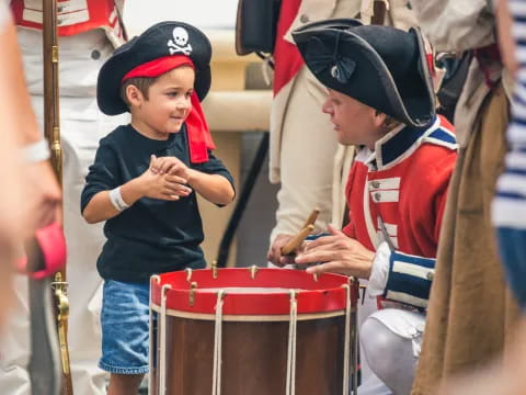 a person and a child playing drums