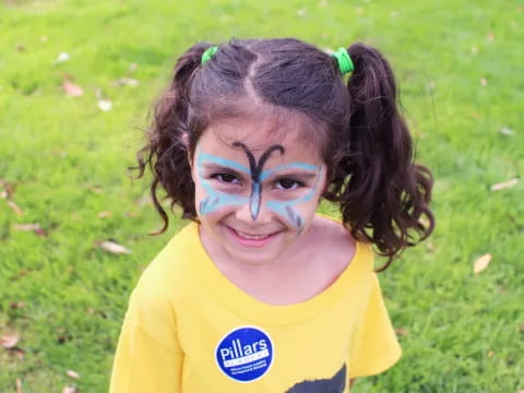 a girl with paint on her face