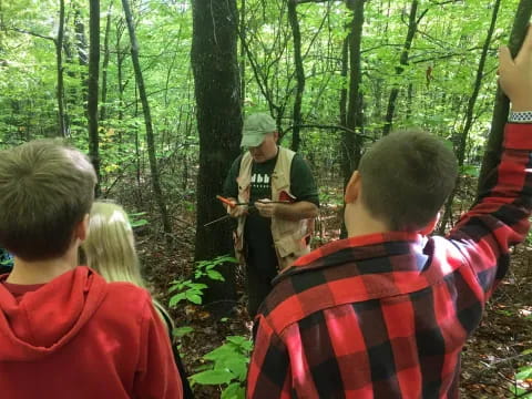 a group of people in the woods