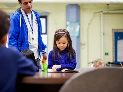 a girl sitting at a desk