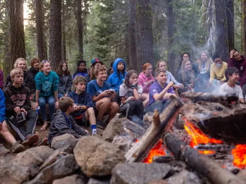 a group of people around a campfire