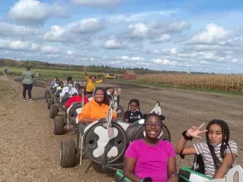 a group of people on a tractor