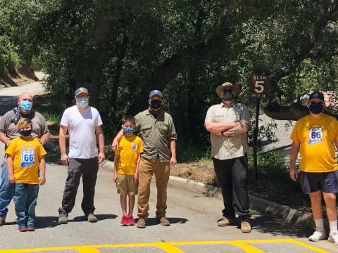 a group of people walking on a street