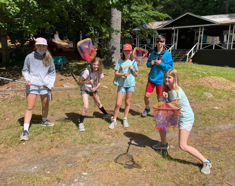 a group of people holding baskets